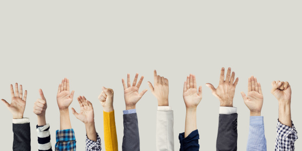 Many hands raised together